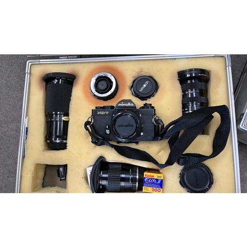 447A - THREE CAMERA CASES WITH CONTENTS OF CAMERAS / LENSES ETC