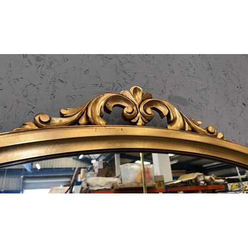 137 - GOLD COLOURED FRAMED ARCH MIRROR