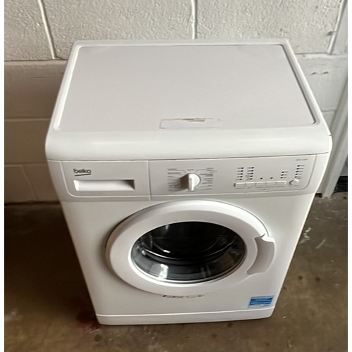 518 - BEKO WASHING MACHINE IN WHITE was used in garage