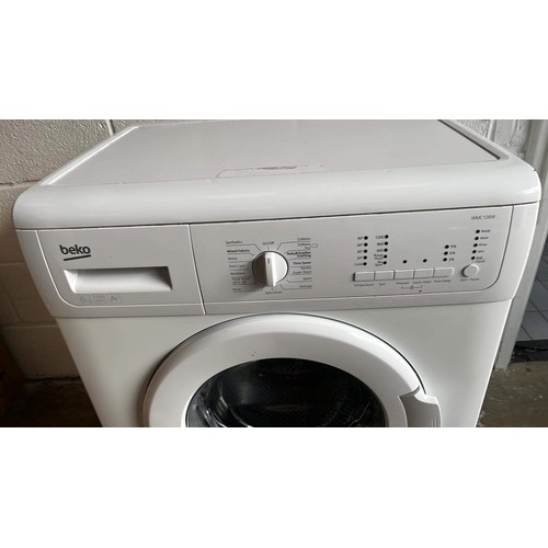 518 - BEKO WASHING MACHINE IN WHITE was used in garage