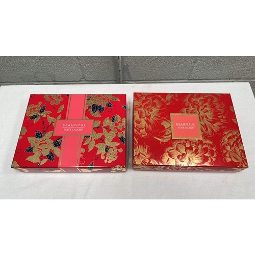 864 - TWO GIFT BOXES OF ESTEE LAUDER