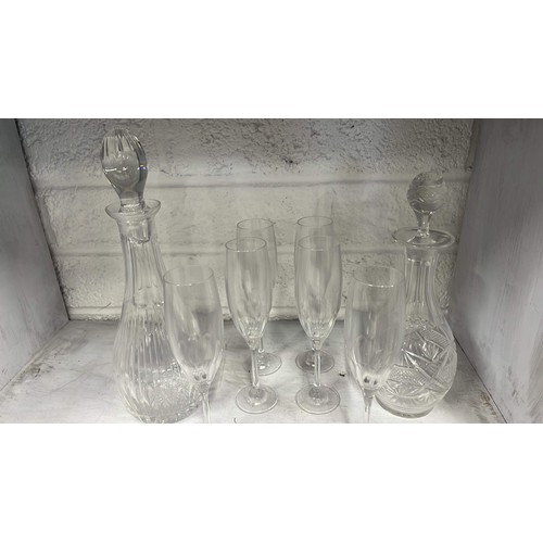 106 - TWO CLEAR GLASS DECANTERS AND GLASSES