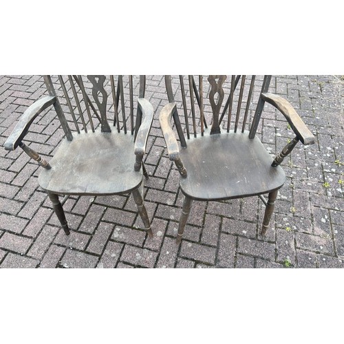 567 - Two wheel back carver chairs