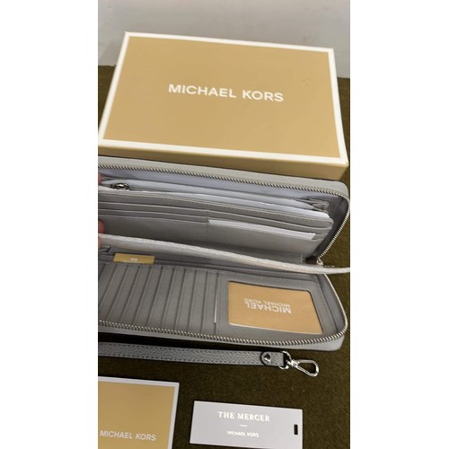 11 - MICHAEL KORS BOXED THE MERCER CLUTCH BAG IN GREY