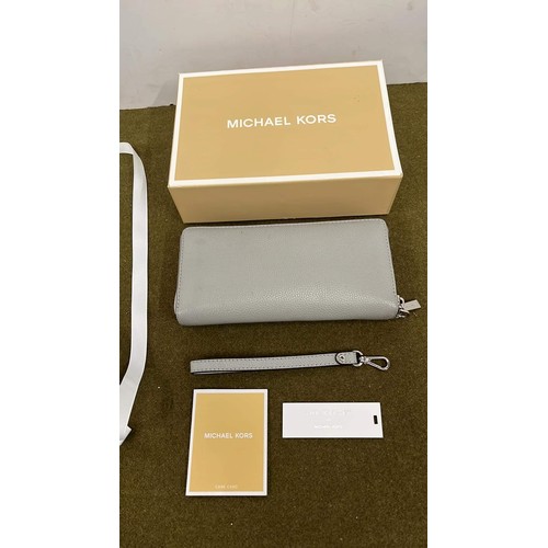 11 - MICHAEL KORS BOXED THE MERCER CLUTCH BAG IN GREY