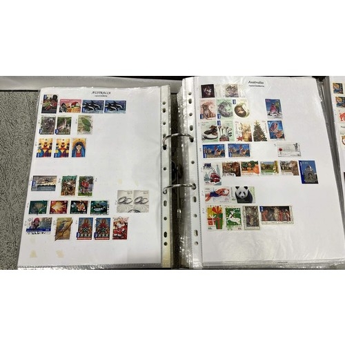 96 - FOUR FOLDERS OF A LIFE TIME COLLECTION OF WORLD WIDE STAMPS SEE ALL PICTURES