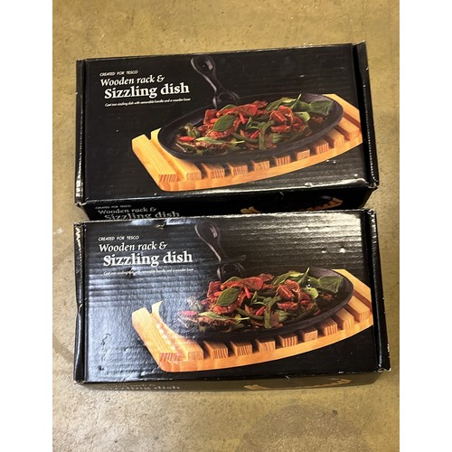 560 - TWO BOXED SIZZLE PLATES