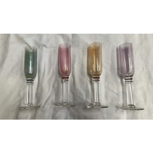 580 - FOUR COLOURED GLASS DRINKING FLUTES