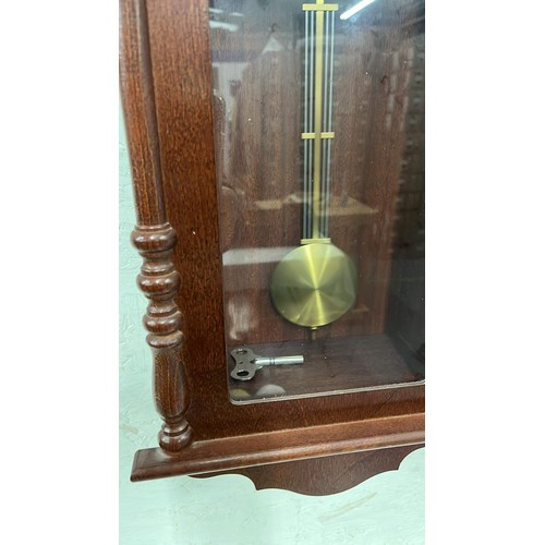 4 - MAHOGANY FINISH WIND UP WALL CLOCK WORKING AND KEEPING GOOD TIME WITH KEY