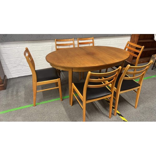 203 - Light finish oval extending table and 6 chairs