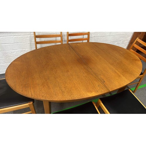 203 - Light finish oval extending table and 6 chairs