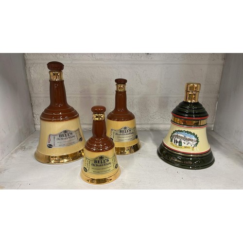 77 - Four wade whiskey bells including one Christmas themed