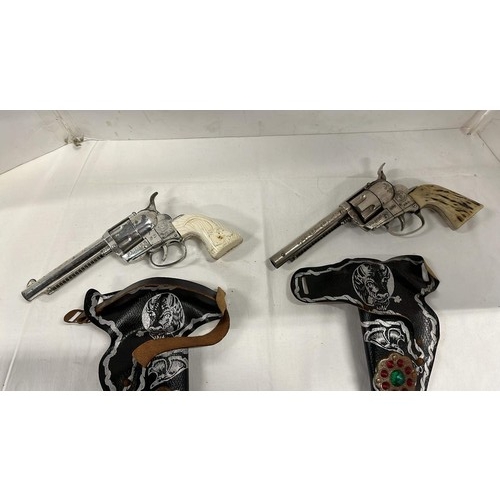 157 - TWO TOY COWBOY HAND GUNS PLAYWORN