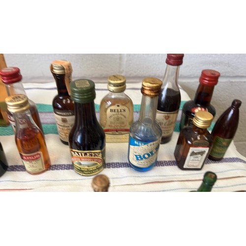 21 - QTY OF MIXED MINIATURE BOTTLES OF ALCOHOL H/C UNCHECKED