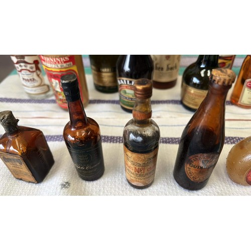 21 - QTY OF MIXED MINIATURE BOTTLES OF ALCOHOL H/C UNCHECKED