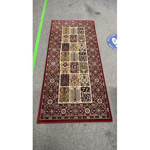 34 - IKEA OVER RUG IN RED PLUS BLACK RUG