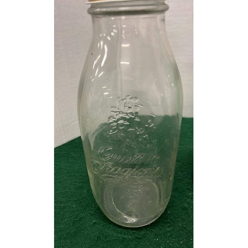 143 - FIVE ASSORTED GLASS MILK BOTTLES