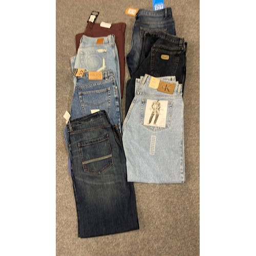 334 - 9 PAIRS OF JEANS IN MIXED COLOURS SIZE 32 WITH TAGS