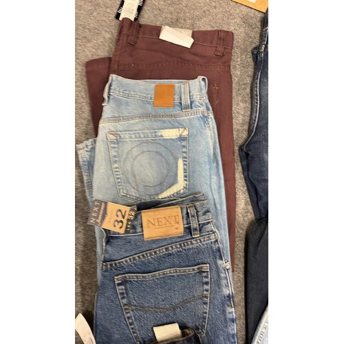 334 - 9 PAIRS OF JEANS IN MIXED COLOURS SIZE 32 WITH TAGS