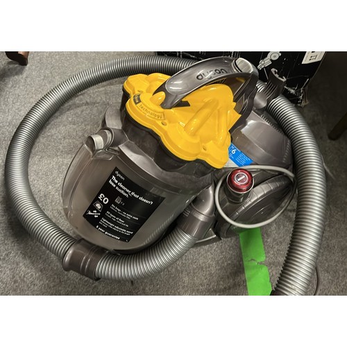 543 - LARGE YELLOW DYSON VACUUM CLEANER USED WITH A QTY OF ATTACHMENTS