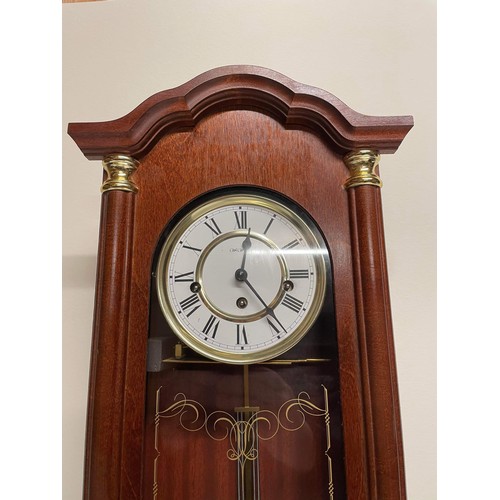 1 - MAHOGANY FINISH WIND UP WALL CLOCK WITH KEY WORKING