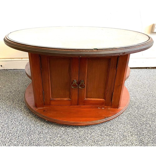 273 - ROUND WOODEN COFFEE TABLE with cupboard space