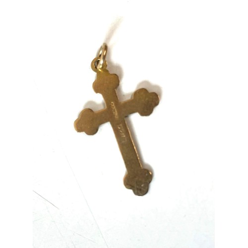 709 - 9ct gold crucifix pendant 0.75 TOTAL WEIGHT