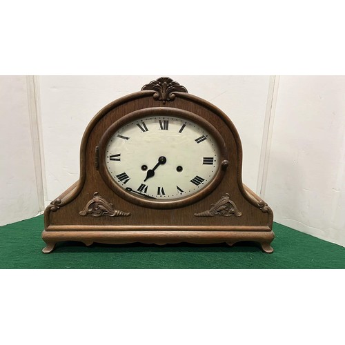 382 - LARGE OAK CASED HELMET SHAPED MANTLE CLOCK WITH ENAMEL FACE WORKING