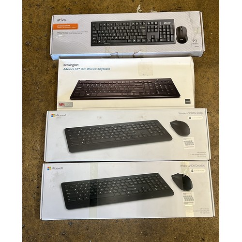 859 - FOUR BOXED PC KEY BOARDS / UNCHECKED