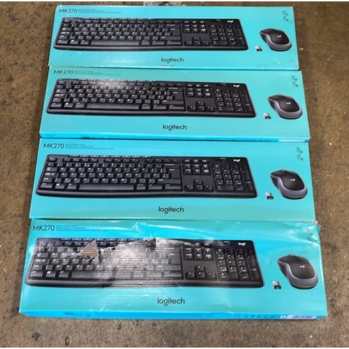 860 - FOUR BOXED LOGITECH KEY BOARDS / UNCHECKED