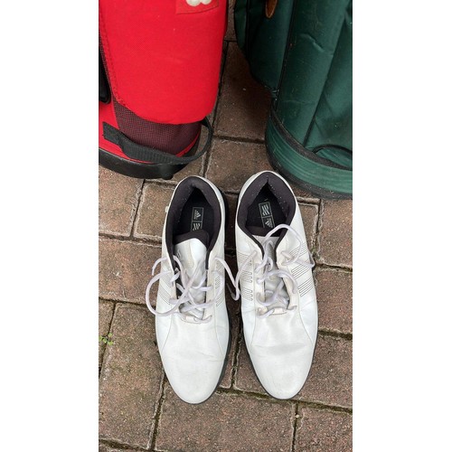 962 - Two golf caddies and shoes with one club