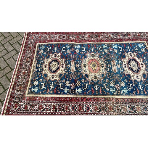 46 - RED AND BLUE PATTERN OVER RUG 211cm x 140cm