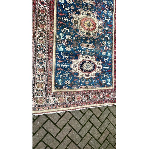 46 - RED AND BLUE PATTERN OVER RUG 211cm x 140cm