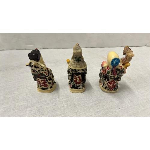 17 - THREE MINIATURE ORIENTAL GODS