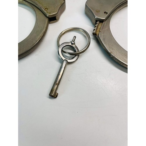 44 - POLICE HANDCUFFS WITH CASE AND KEY