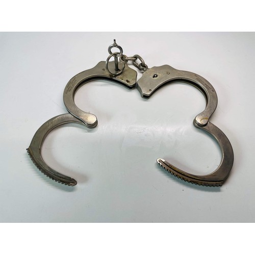 44 - POLICE HANDCUFFS WITH CASE AND KEY