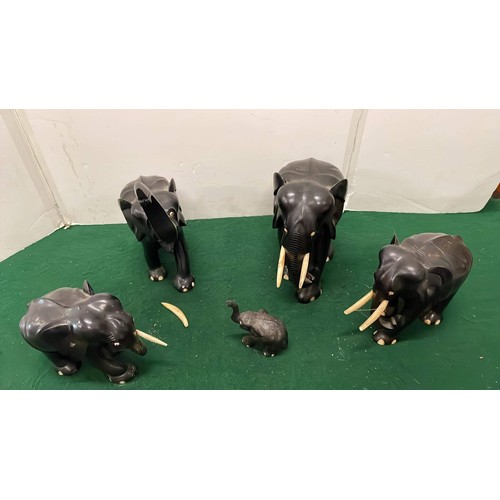 280 - FIVE BLACK EBONY MIXED SIZE ELEPHANT FIGURES