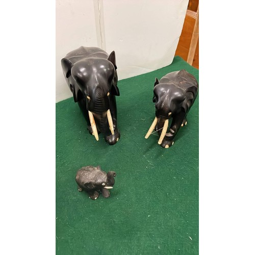 280 - FIVE BLACK EBONY MIXED SIZE ELEPHANT FIGURES