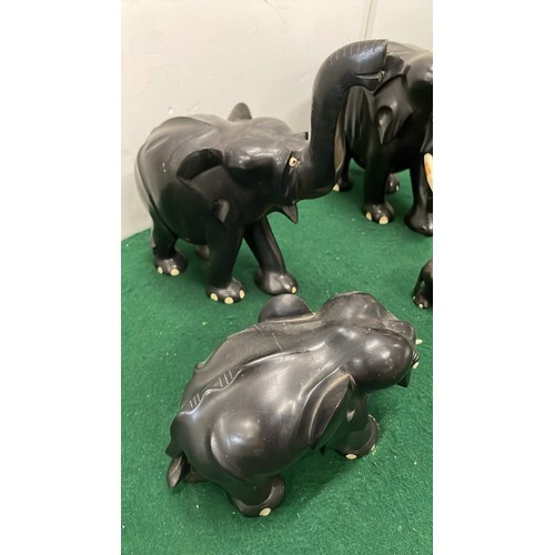 280 - FIVE BLACK EBONY MIXED SIZE ELEPHANT FIGURES