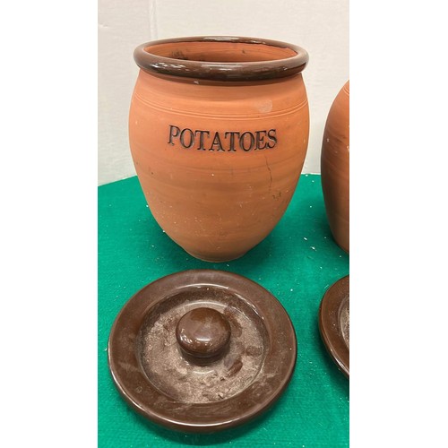 687 - TWO TERRACOTTA STORAGE JARS