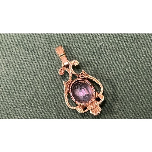 48 - 9CT GOLD AND AMETHYST PENDENT