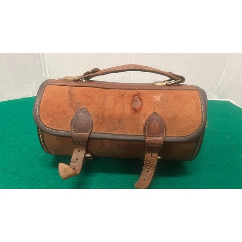 672 - LEATHER BAG WITH TWO BOWLS