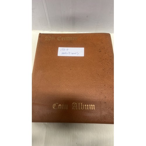 98 - BROWN FOLDER WITH 100 WORLD WIDE COINS