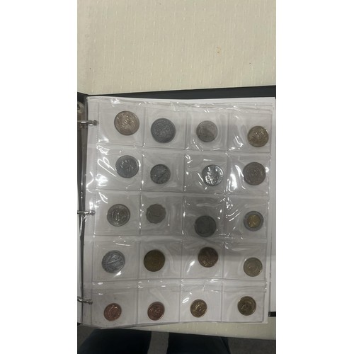 809 - FOLDER OF WORLD COINS