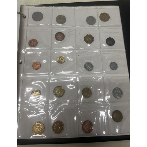 809 - FOLDER OF WORLD COINS