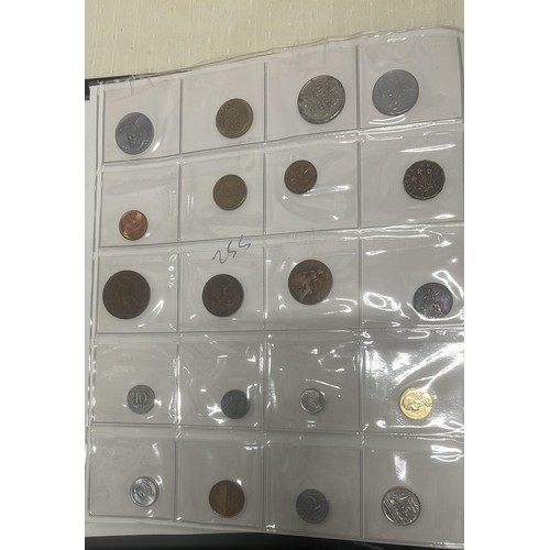 809 - FOLDER OF WORLD COINS