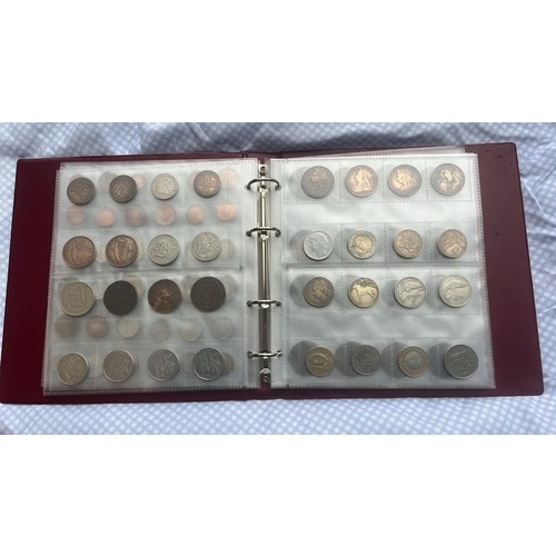 814 - FOLDER OF 200 WORLD COINS