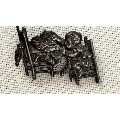 53 - SILVER INFANTS PLAYING BROOCH