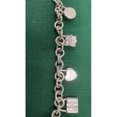 107 - TIFFANY & CO 925 SILVER CHARM BRACELET 34g