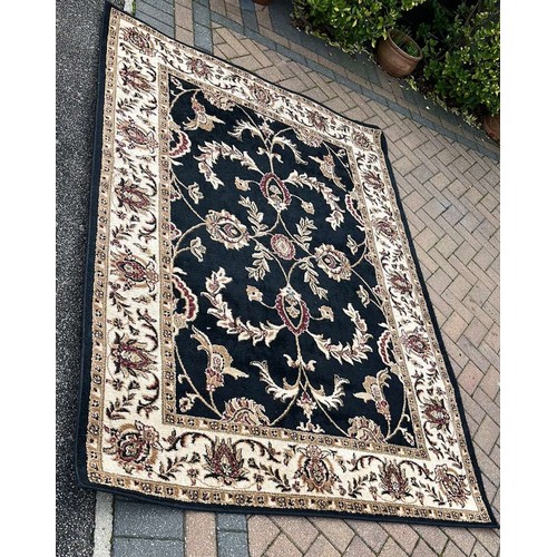 565 - LARGE BLACK OVER FLOOR RUG 7 X 4 ft